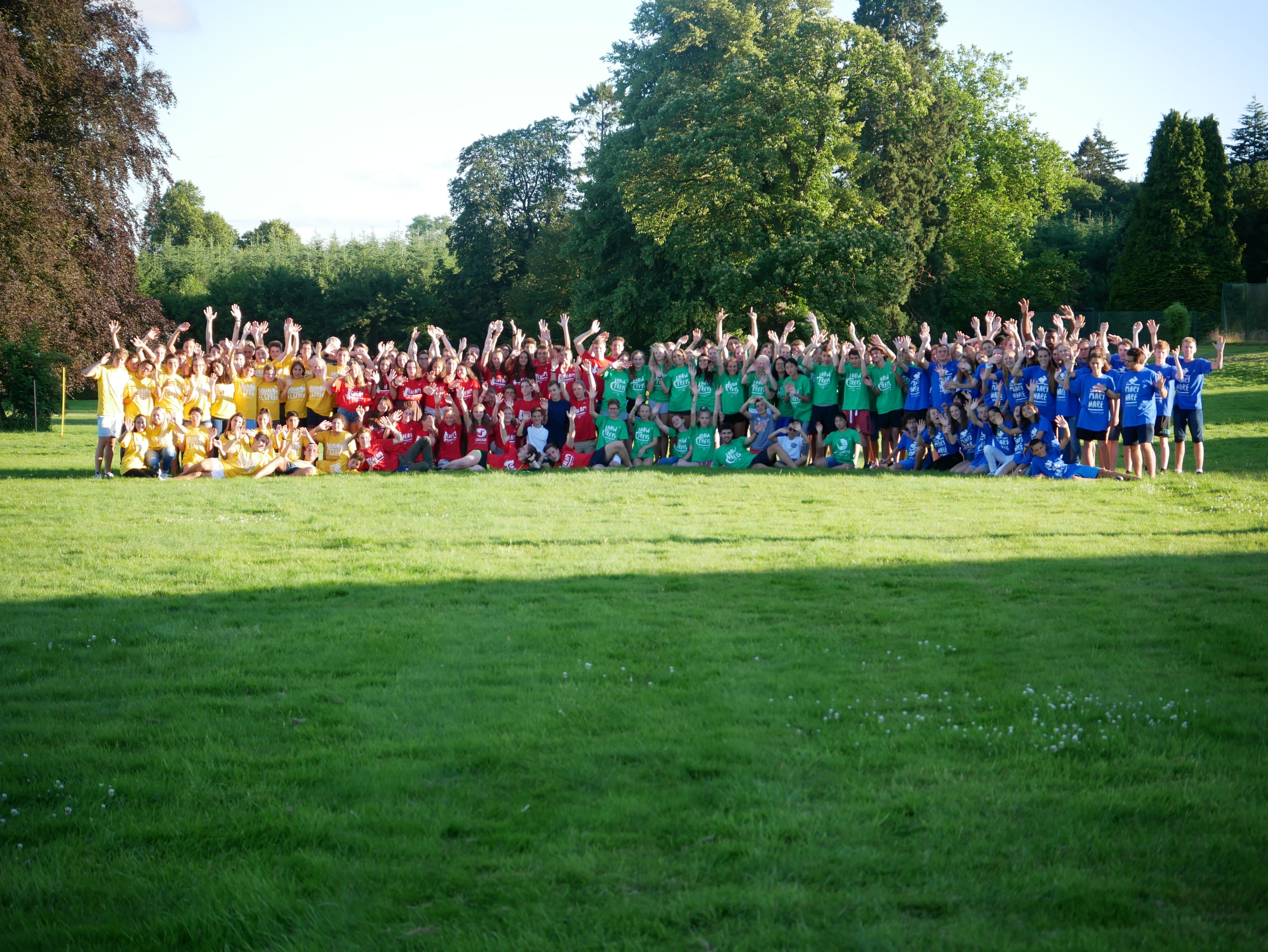 Students together on the grass